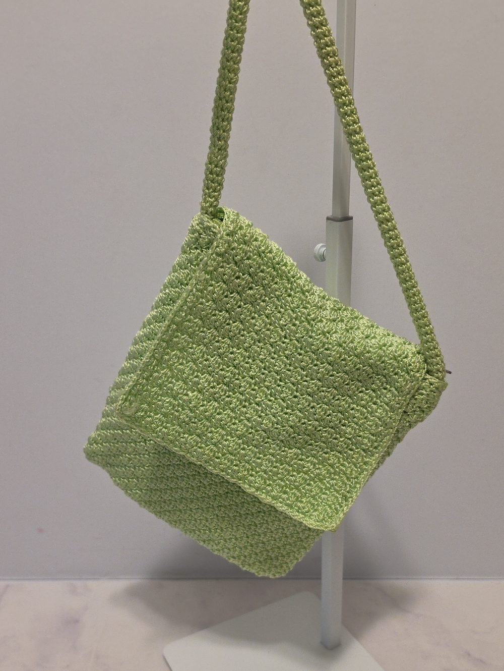 The Sak  Light Green Crochet Crossbody Bag